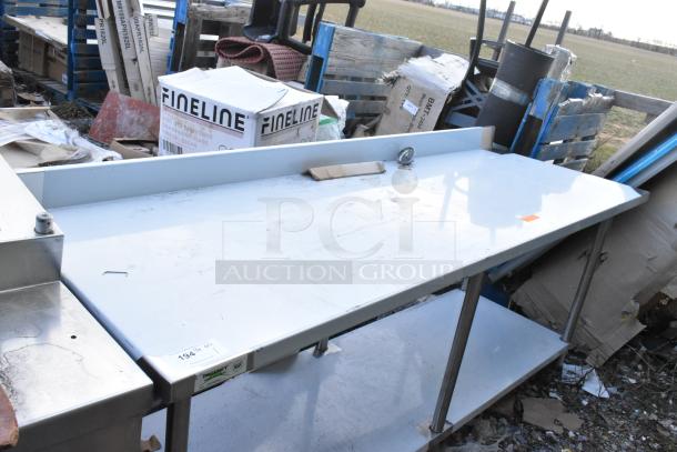 Regency 600TSB3084S stainless steel commercial table with metal under shelf; used condition with minor surface marks.