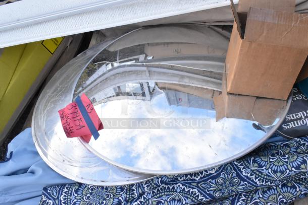 12 mixed items, including patio umbrellas and mirrors. Notable features: reflective mirrors, assorted fabric patterns. Visible tags read "A3" and "37915A".
