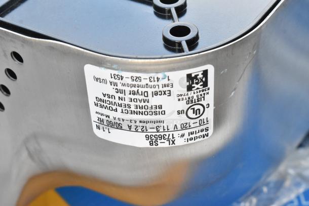 Xcelerator Hand Dryer, serial #1136536, stainless steel finish, label reads "Excel Dryer Inc., Made in USA."
