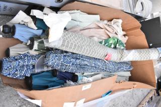 Cardboard box filled with 16 assorted patio umbrellas, various designs and colors, mixed condition.