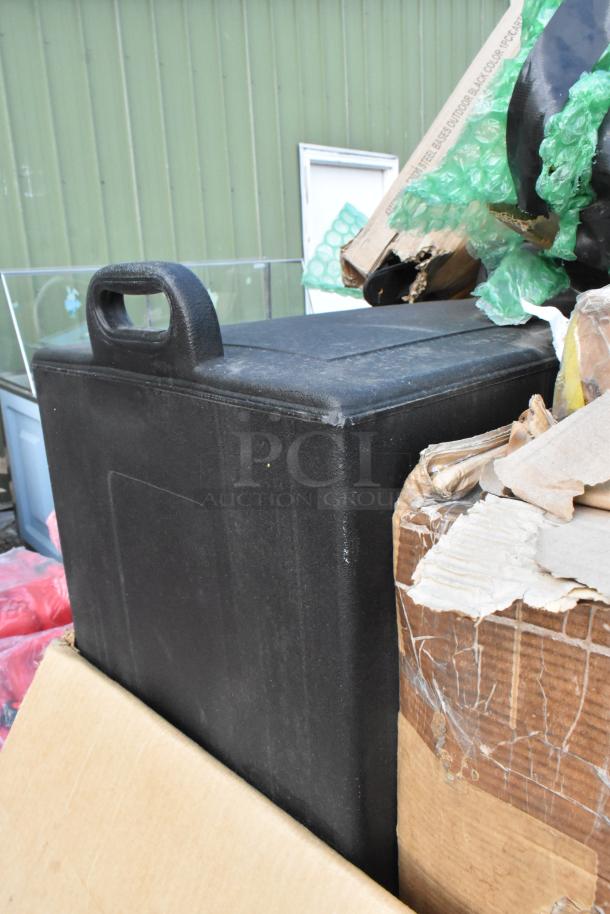 Brand new scratch and dent items, including an ice bin with a black handle, visible alongside cardboard and bubble wrap.