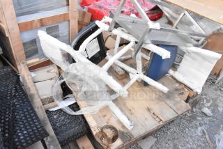 New scratch and dent lot including Suncast BMCCPD3600 cabinet and butcher paper roll, wrapped on a pallet.