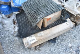 12 new scratch and dent items, including Lavex 3' x 3' rubber mats (844LRGTMA3636). Tags show Lavex and World Centric boxes.