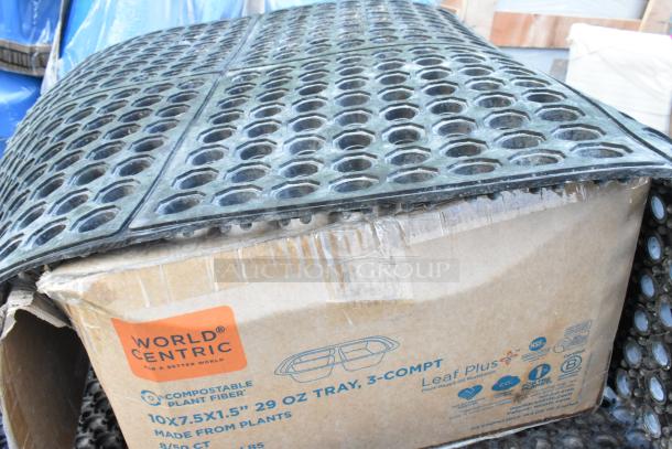 Lavex 3'x3' rubber interlocking floor mat, new, atop damaged World Centric compostable containers box.