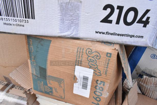 Boxes of scratch and dent items, including Scott paper towel dispenser. Visible labels show model number 58091 and origin.