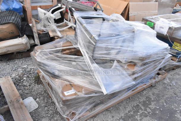 14 new scratch and dent items, including a butcher block table top and chair, wrapped on a pallet.