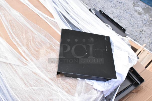 Brand new black metal locker system with minor scratches and dents. Metal pieces unassembled, wrapped in protective plastic.