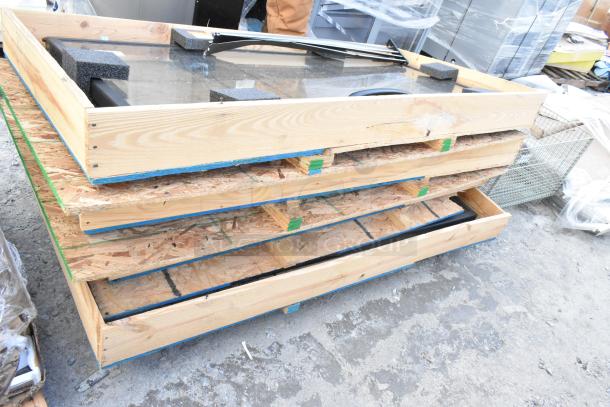 Brand new glass merchandiser doors in crates. Includes four items. Ideal for commercial display, ready for installation.