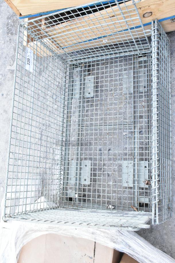 Metal wire basket, sturdy construction, grid pattern, minor wear visible. Tag marked 220 indicating item number.