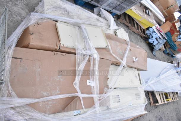 Tan metal locker system, disassembled, wrapped in plastic and cardboard. Slight wear visible, labeled with item number 221.