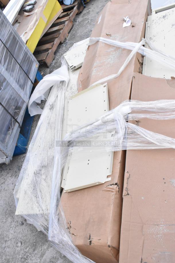 Tan metal locker system, disassembled, packed in cardboard with plastic wrap, minor wear visible, ready for assembly.