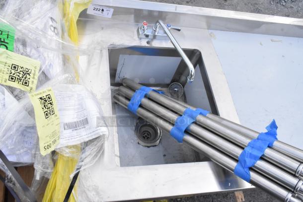 Brand new Regency 600ST3096L table with integrated 16x20x12 sink, 30x96, 304SS. Scratch and dent condition. Tags visible.