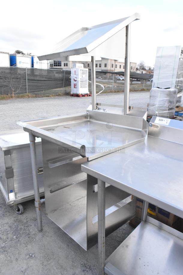 Stainless steel dishwasher table with over and under shelf, clean side design, suitable for commercial use. Excellent condition.