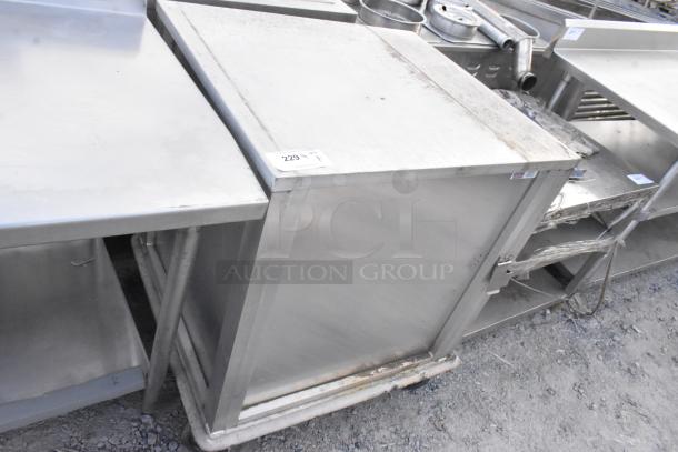 United Metal food carrying case on commercial casters, used condition, metal exterior with some visible wear.
