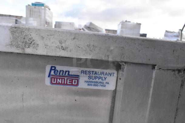 United Metal Food Carrying Case with commercial casters, from Penn Restaurant Supply, shows signs of use.