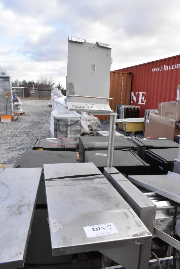 Hobart HWS-4 stainless steel wrapping station, floor style, 120V, 1 phase, commercial use, showing signs of wear.