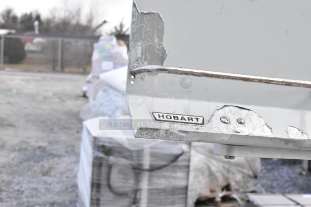 Hobart HWS-4 wrapping station, stainless steel, visible wear, with Hobart label, 120 volts, 1 phase.