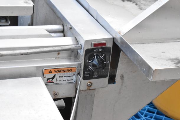 Hobart HWS-4 stainless steel wrapping station, 120V, 1 phase. Features timer dial, warning label on hot surfaces. Commercial use.