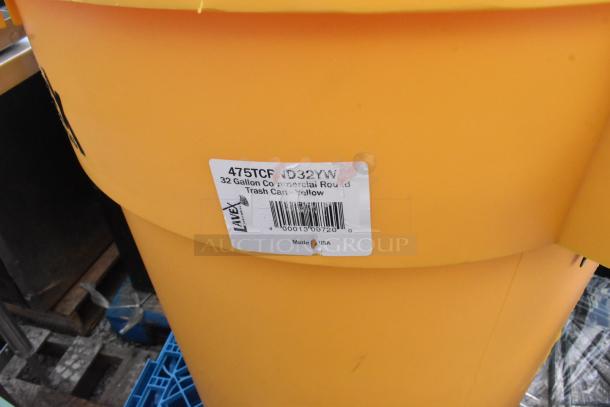 Yellow 32-gallon Lavex trash can, commercial round, new condition with some scratches. Label indicates made in USA.