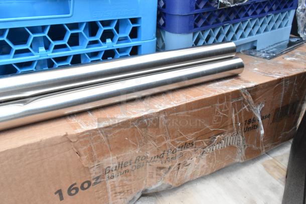 7 assorted new scratch-and-dent items, including trash cans and dish caddies. Features cardboard packaging and metal rods.