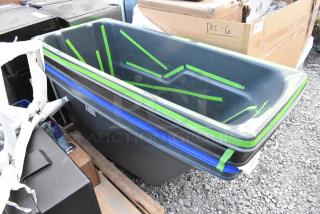 Brand new poly tilt truck with minor scratches and dents, Avex label visible. Ideal for industrial use, durable construction.