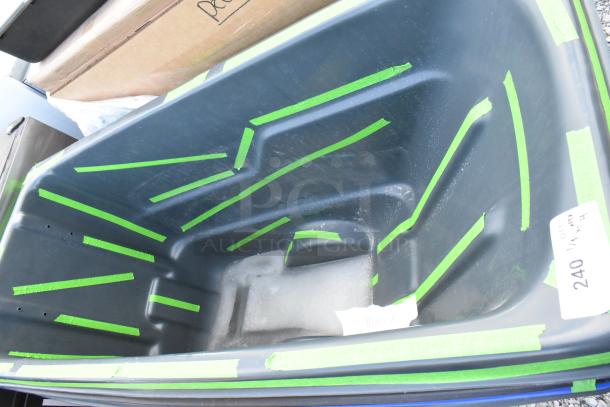 4 brand new poly tilt trucks, slightly scratched. Green tape highlights imperfections. Tag reads: "240 1/4 MX - 4."