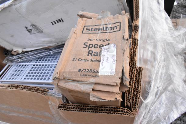 Cardboard box labeled "Steelton 36-inch Single Speed Rail, 21 Gauge Stainless Steel" shows new item with slight packaging damage.