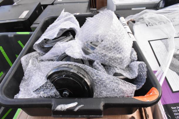 Assorted brand new casters wrapped in bubble wrap in a black tray. Part of a lot including Katchall Flatware Retriever and Speed Rail.