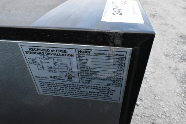 Haier HC32TW10SV mini cooler, 3.2 Cu.Ft., 115V-60Hz, model info label visible, features freestanding installation.