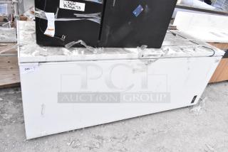 Frigidaire FFCL2542AW chest freezer, 115 Volts, signs of wear, auction tag showing $249, "USED ASSETS" label visible.