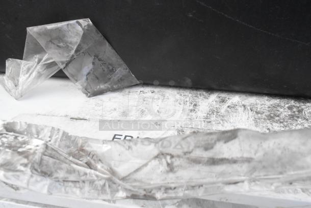 Frigidaire FFCL2542AW chest freezer, 115 volts, 1 phase, visible label, with protective plastic, showing new condition.