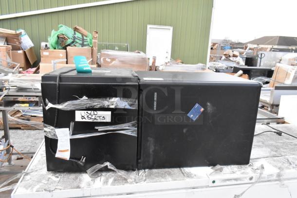 Black & Decker BCFA27B mini cooler, used condition, 115V, 1 phase, black exterior, visible "Used Assets" label taped on front.