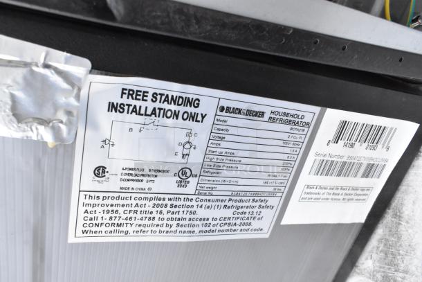 Black & Decker BCFA27B mini cooler label. 2.7 cu ft capacity, 115 volts, 1 phase. Includes installation and safety info.