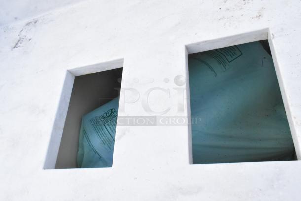 White trash can shell with dual deposit holes, showing interior bags. Features clean exterior and functional design.