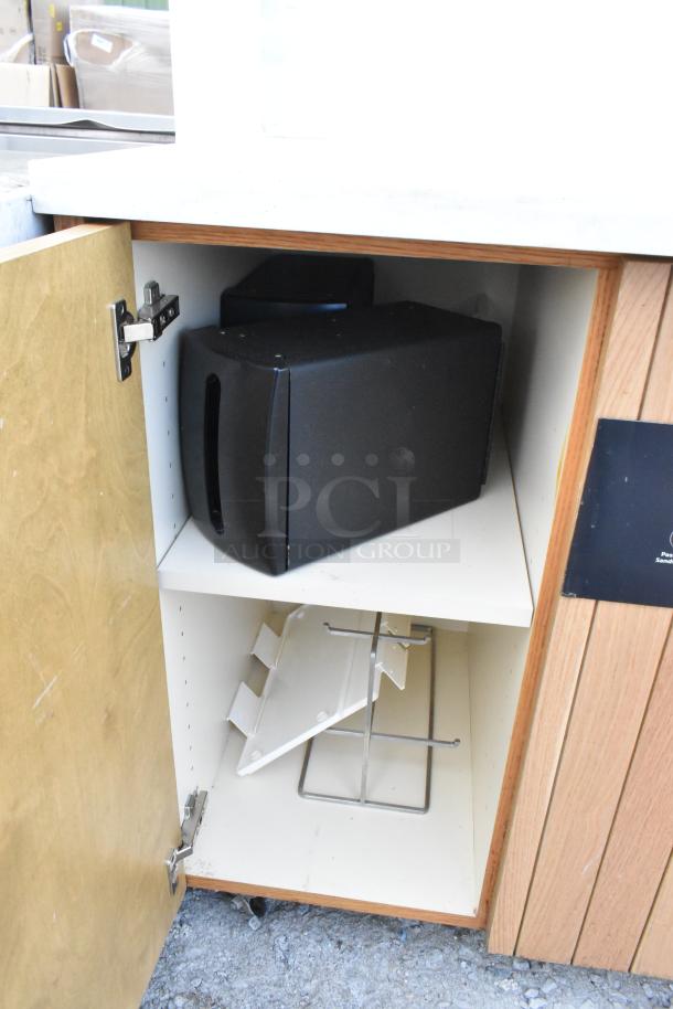 Wooden trash can shell with open doors, featuring trash deposit holes. Includes internal storage sections. Good condition.