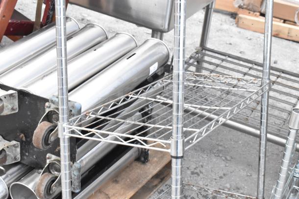 Chrome finish 5-tier wire shelving unit in used condition. Buyer must dismantle. Consider freight charges for shipping.