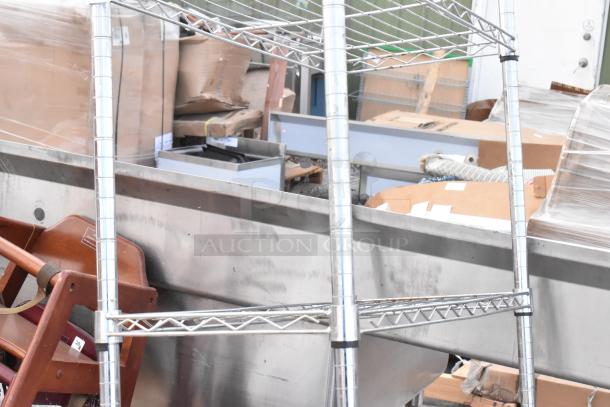 Chrome finish 5-tier wire shelving unit in good condition. Buyer must dismantle. Consider freight charges.