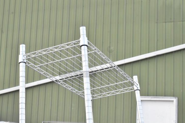 Chrome finish 5-tier wire shelving unit in good condition. Buyer must dismantle. Consider freight charges.