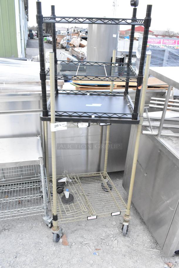 Two-tier wire shelving units on commercial casters, one missing casters. Buyer must dismantle; freight charges apply.