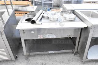 Duke WB303 M stainless steel commercial steam table with 3 wells, natural gas powered, includes lids and attachments, in used condition.