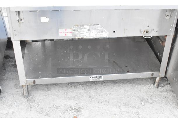 Duke WB303 M stainless steel 3 well steam table, natural gas powered, with caution labels, visible wear.