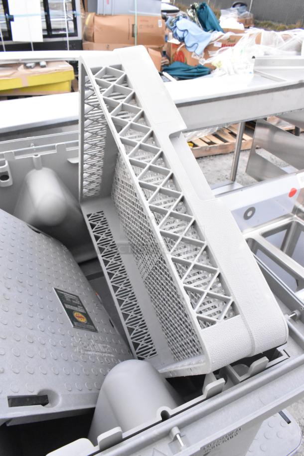 Plastic grease traps and dish caddy, Hobart brand, featuring lattice design, in used condition, visible manufacturer label.