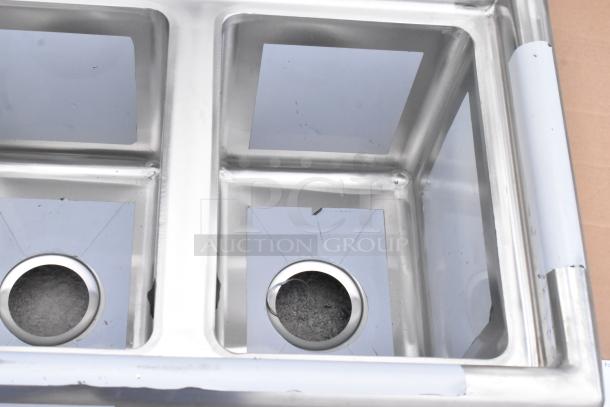 Regency 600S31014 stainless steel 3-compartment sink, scratch and dent, no legs, 58" with 10"x14"x10" bowls, 2 drainboards.