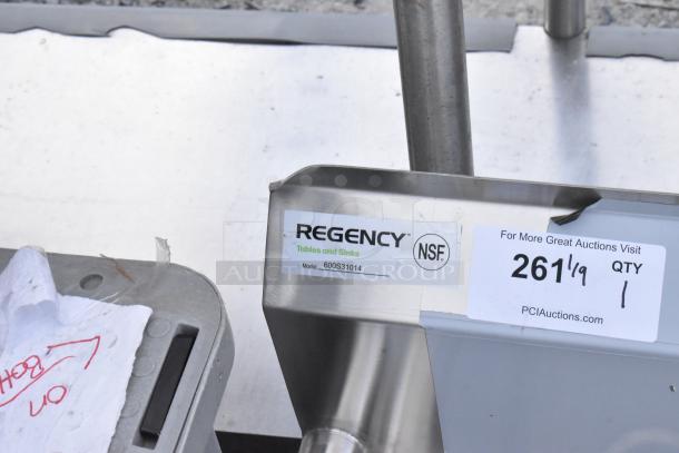 Regency stainless steel sink, model 600S31014, brand new, with 3 compartments, missing legs, NSF label visible.