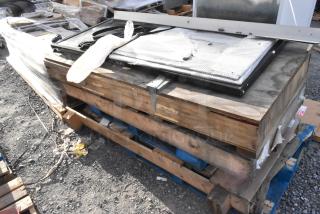 Three brand new 29-1/16"x66-9/16" doors in crate, stacked on pallets, in excellent condition, ready for auction.