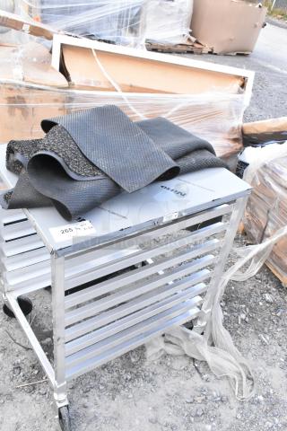 Regency metal commercial pan transport rack with floor mat on top, brand new with minor scratches and dents, tags visible.