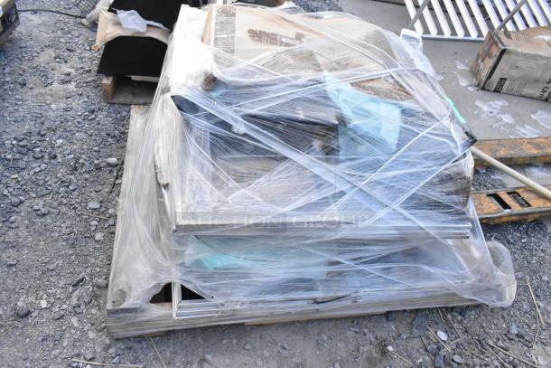 Pallet of 11 brand new scratch and dent items wrapped in plastic. Includes various black pieces. Auction lot.