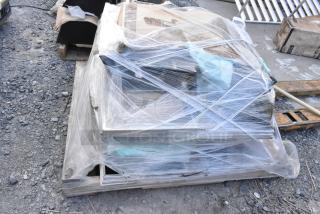 Pallet of 11 brand new scratch and dent items wrapped in plastic. Includes various black pieces. Auction lot.