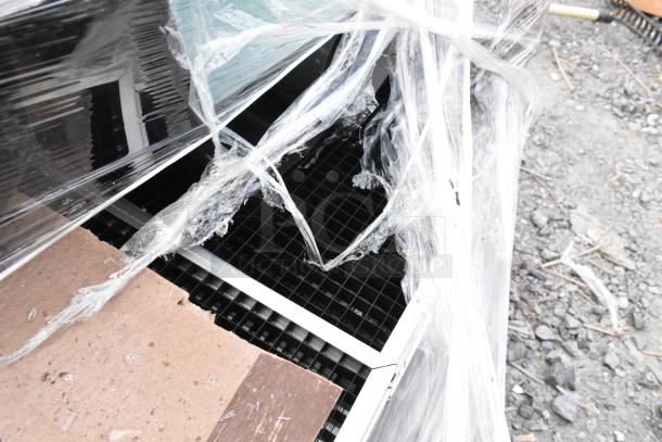 Package of 11 new items, some with minor scratches and dents. Includes black pieces. Wrapped in plastic with visible grid-like structures.