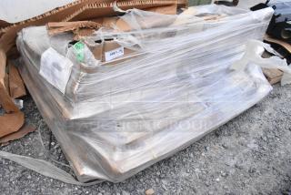 Seven new Regency stainless steel fixtures, wrapped, labeled "268/6," including wall-mounted pot rack and work table.